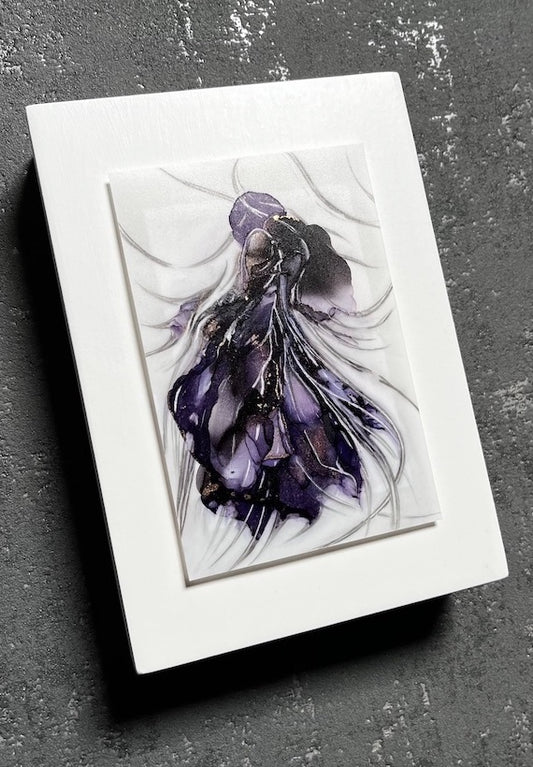 Symbolism art of transformation in which purple and black colours coalesce into a hybrid animal. This moody art is mounted on a white panel and hung on a dark grey wall.