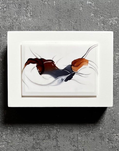 Art for walls featuring earthy colours of browns and greys in a surrealist and abstract form of a forest spirit, hung on an interior grey wall.
