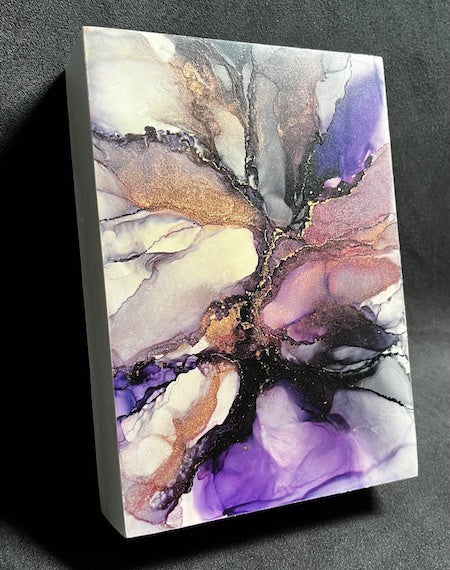 Abstract space art featuring hand painted remnants of a supernova in black, copper, purple and white colours. This 5x7 original painting for sale is hand painted and rests on a black backdrop.