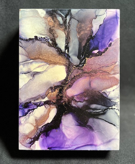 Abstract space art of a supernova in purple and black, copper and white colours.