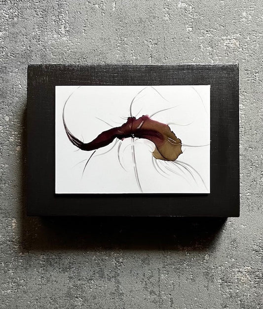 Surreal art for walls featuring dark colours with lines that flow out, creating an organic form that lends its shape from leaves, flowers and animals of the deep. Intriguing and unusual art mounted to a dark cradled board.