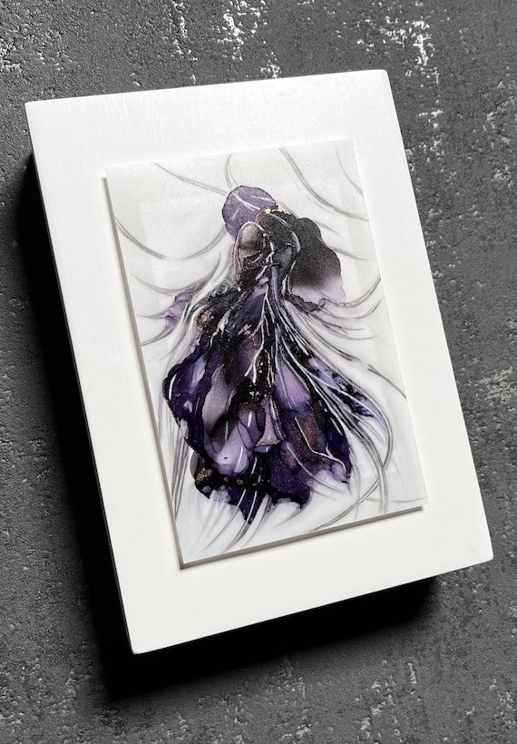 Symbolism art of transformation in which purple and black colours coalesce into a hybrid animal. This moody art is mounted on a white panel and hung on a dark grey wall.