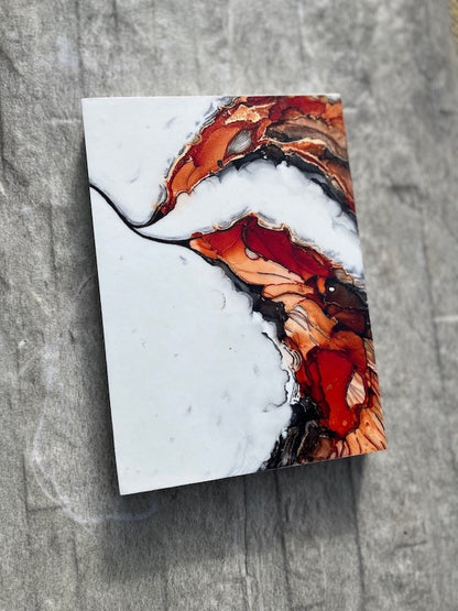 Art for gallery walls featuring fantasy artwork of orange and black fantasy wings inspired by the fire bird, the phoenix, symbolic of alchemy and rebirth on a stone backdrop.
