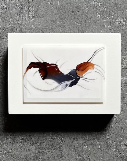 Art for walls featuring earthy colours of browns and greys in a surrealist and abstract form of a forest spirit, hung on an interior grey wall.